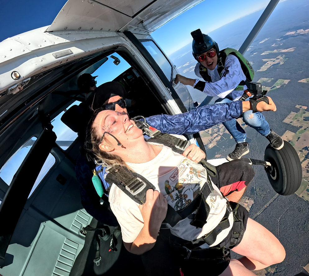 Tandem skydive Perth, preparing to exit the aircraft with an instructor at The Skydive School in WA, ready for an unforgettable freefall experience.