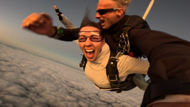 Tandem Skydiving Perth & South West WA 1 Tandem skydiver screaming with joy in freefall above the clouds with her instructor