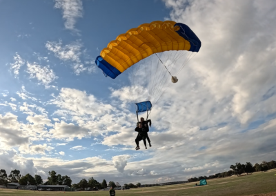 Instructor and student smiling during a tandem skydive over Western Australia.