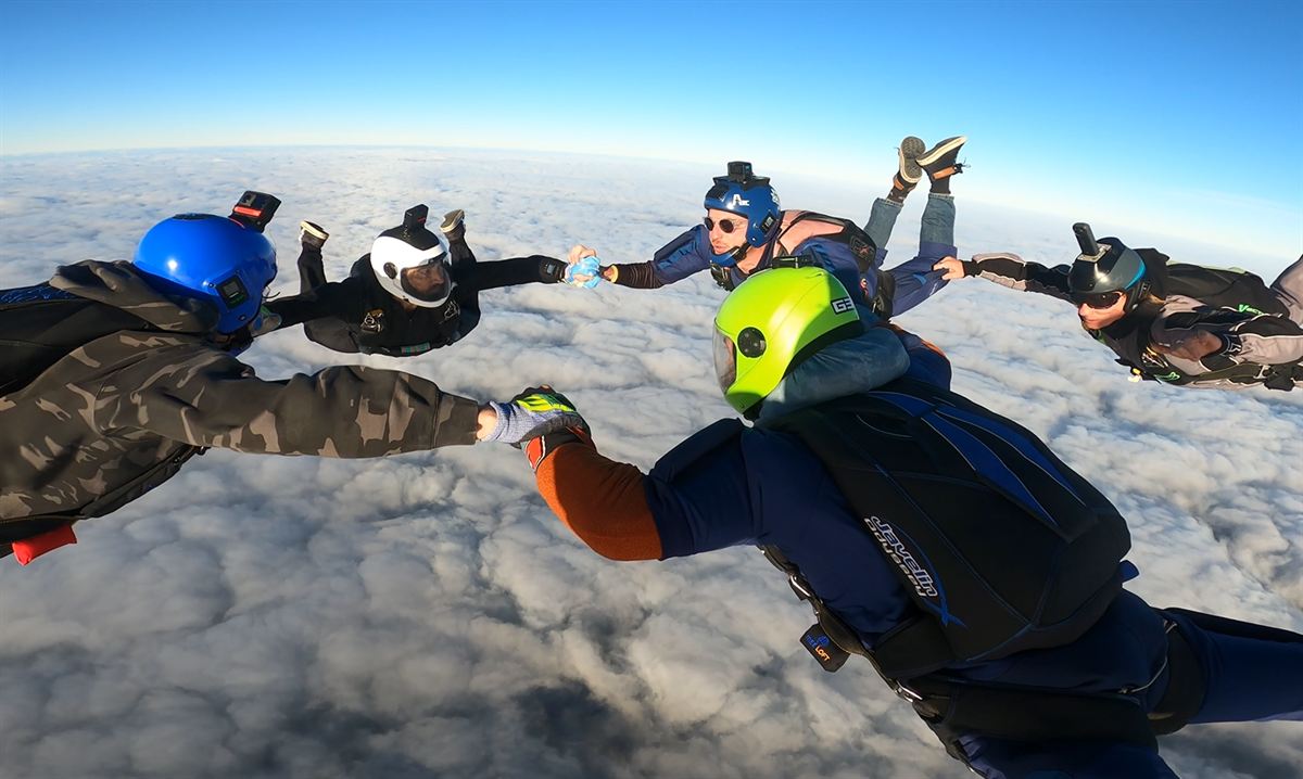 Learn to Skydive – AFF Course (deposit) 2 Learn to skydive students in formation over WA